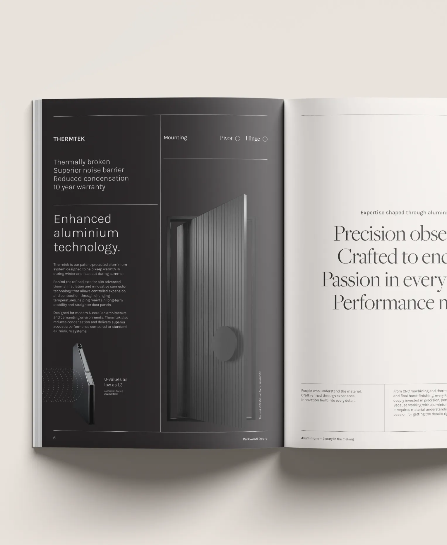 An open Parkwood brochure, one dark page headed “Enhanced aluminium technology.”
