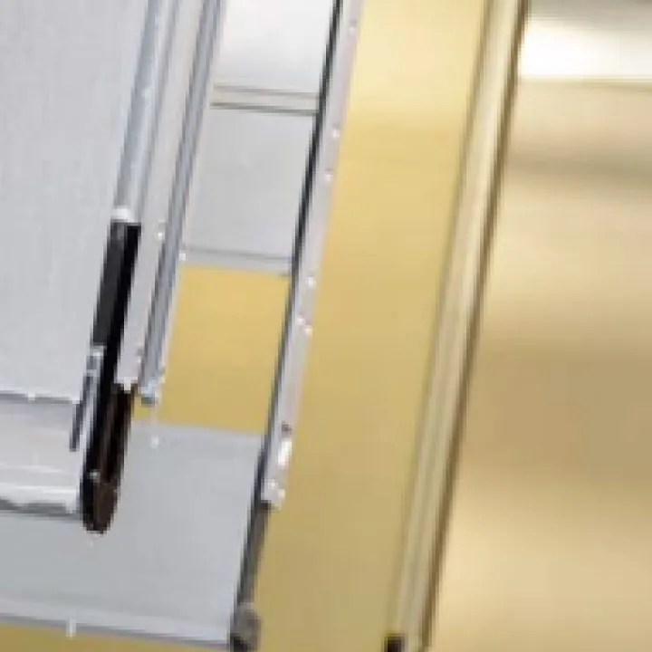 Stacked gold and silver aluminium sheets and profiles in the factory